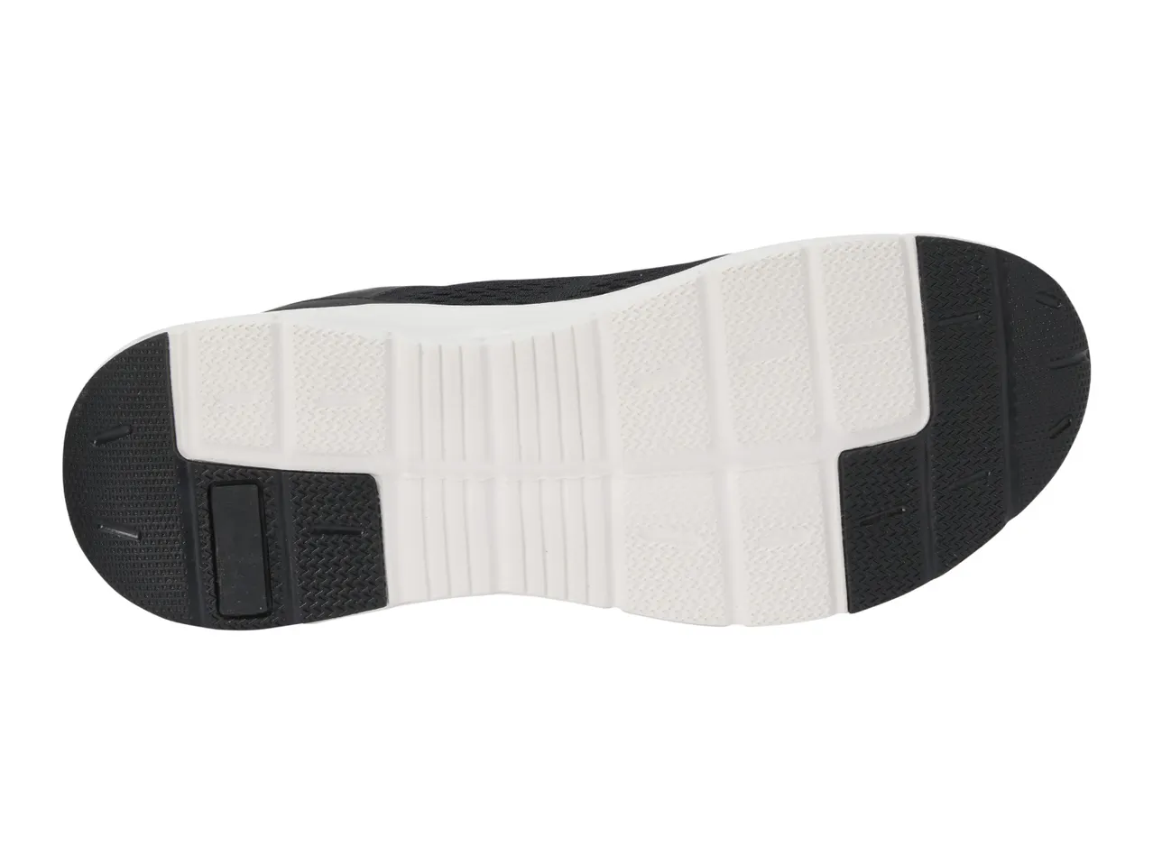 Bottom view of a black and white athletic shoe sole with textured grip patterns.