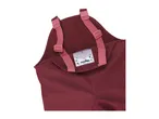 Close-up of a child's red waterproof dungarees with pink adjustable straps and a name tag.