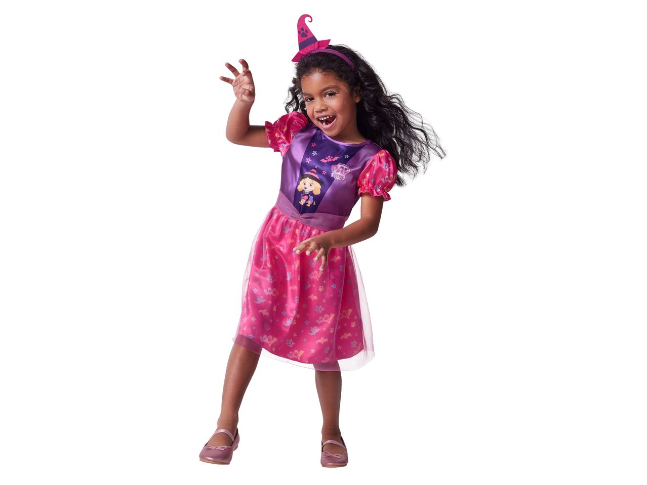 A young girl in a Paw Patrol Skye witch costume, with a pink dress and witch hat.