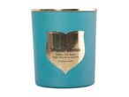 Moonlit Blooms scented candle in a teal jar with a gold label