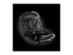 Open black sandwich maker with triangular cooking plates on a dark background.