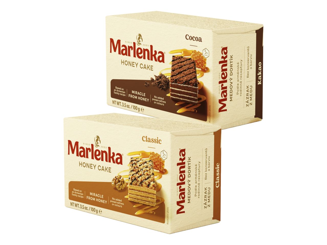 Dve škatli medenih tort Marlenka, ena s kakavom in druga klasična.