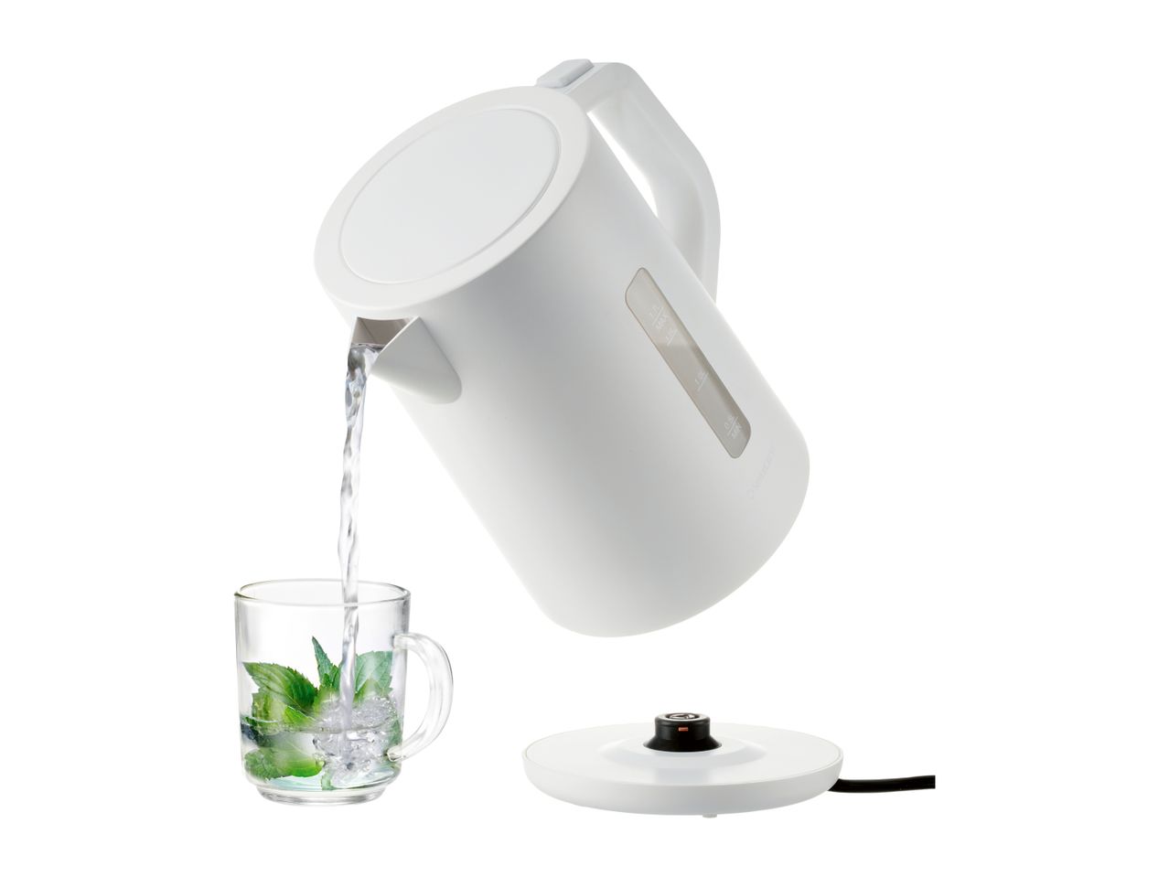 A white cordless electric kettle pours water into a glass.