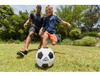 Father and son playing soccer with a CRIVIT ball on a sunny day.