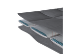 Cutaway view of a mattress with multiple layers, including a layer with blue beads.