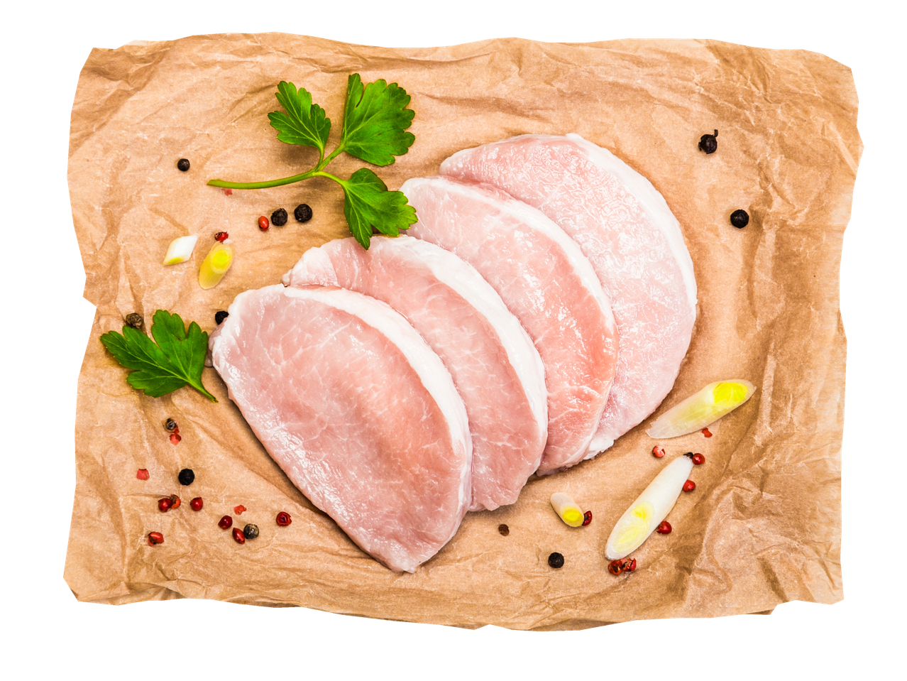 Neli toorest seakarbonaadiviilu pruunil paberil, kaunistatud ürtide ja vürtsidega.