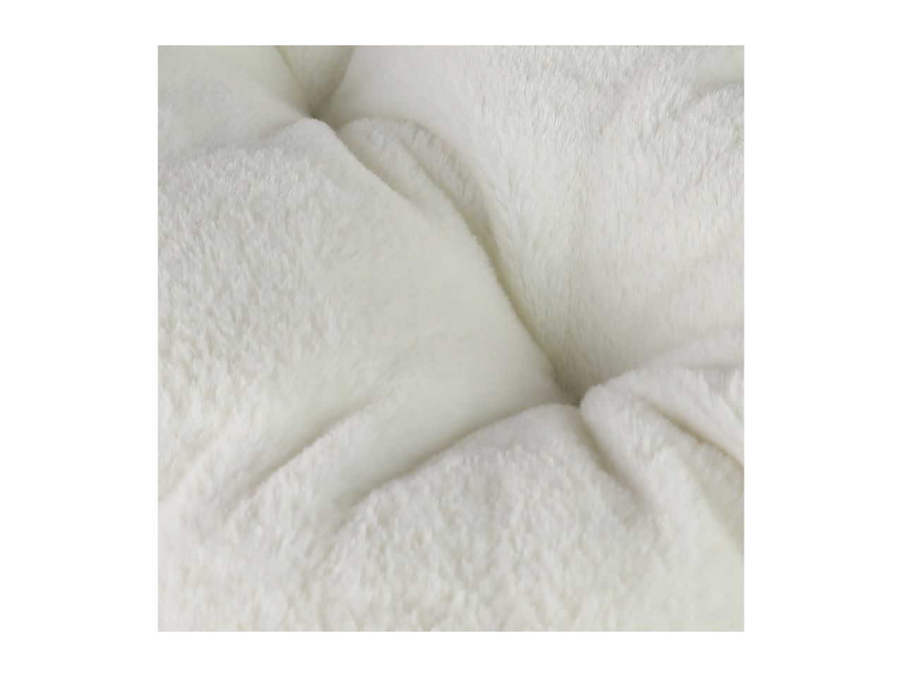 Close-up of a fluffy white cushion with a tufted design.