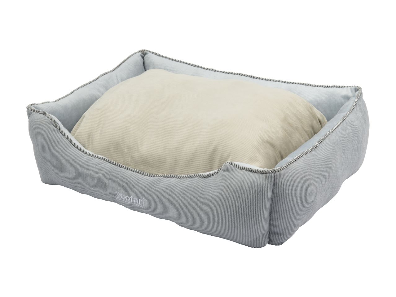 Grå hundeseng med en beige pude