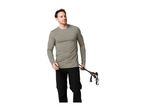 A man in a grey long-sleeved shirt and black trousers holding trekking poles.