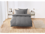 Gray duvet cover set with geometric pattern on a bed in a modern bedroom.