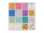Bead set with various colorful beads, gold beads, and white charms in a clear organizer.