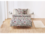 Floral duvet cover set on a bed in a light and airy bedroom.
