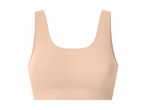En beige sports-bh eller bralette med brede stropper og en glat finish.