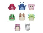 Seven colorful squishy toys, including a red fish, blue crab, pink yeti, green cactus, brown dog, purple squirrel, and a silver mystery toy.