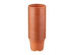 Stack of brown plastic plant pots