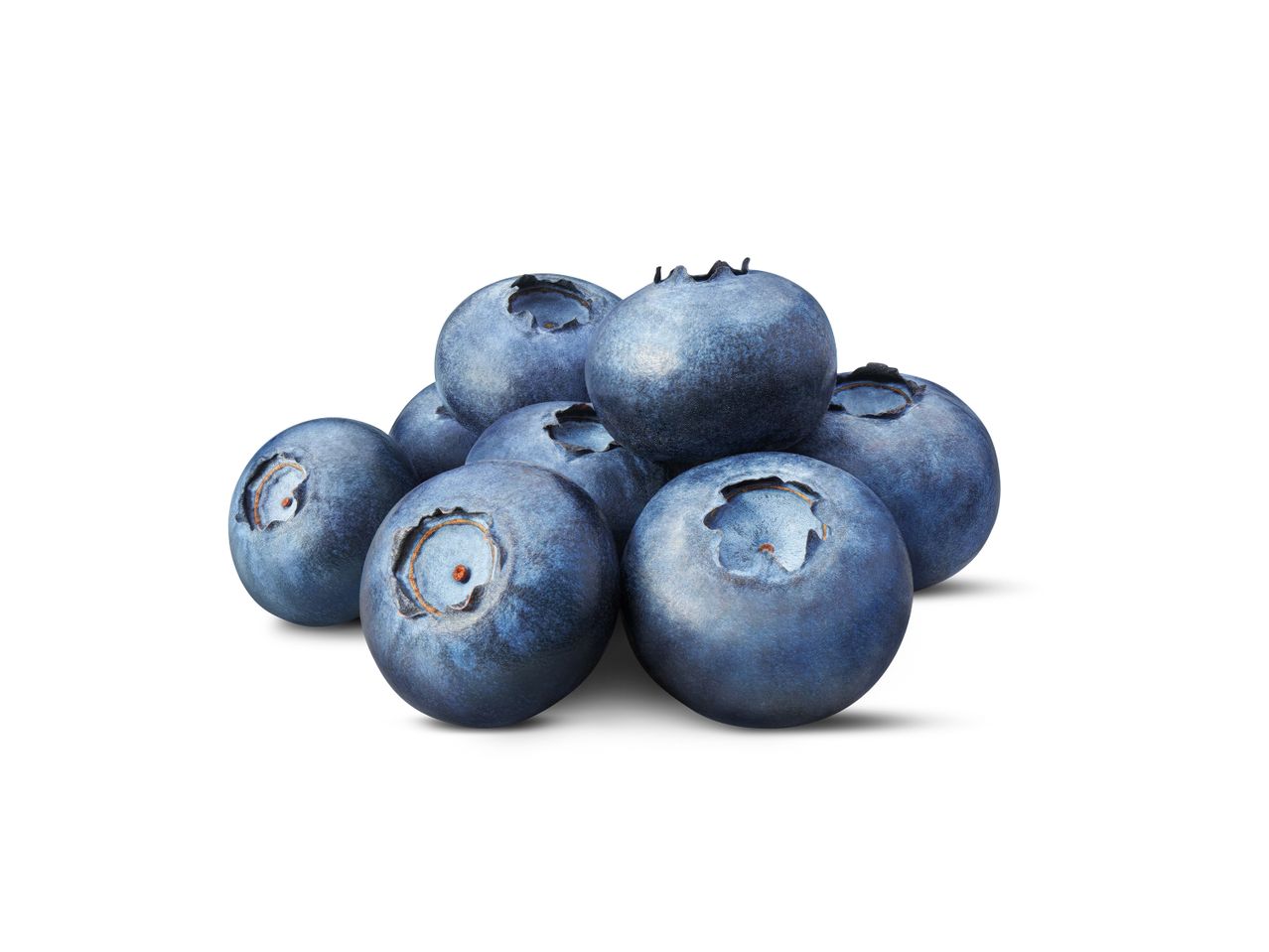 A pile of fresh, ripe blueberries with a slight shadow underneath.