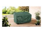 A dark green patio furniture cover sits on a wooden deck, surrounded by potted plants.