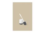 White toilet brush with a dark grey head and a white holder on a beige background.