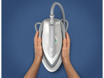 Hands holding a Philips Steam Generator iron with a station on a blue background.