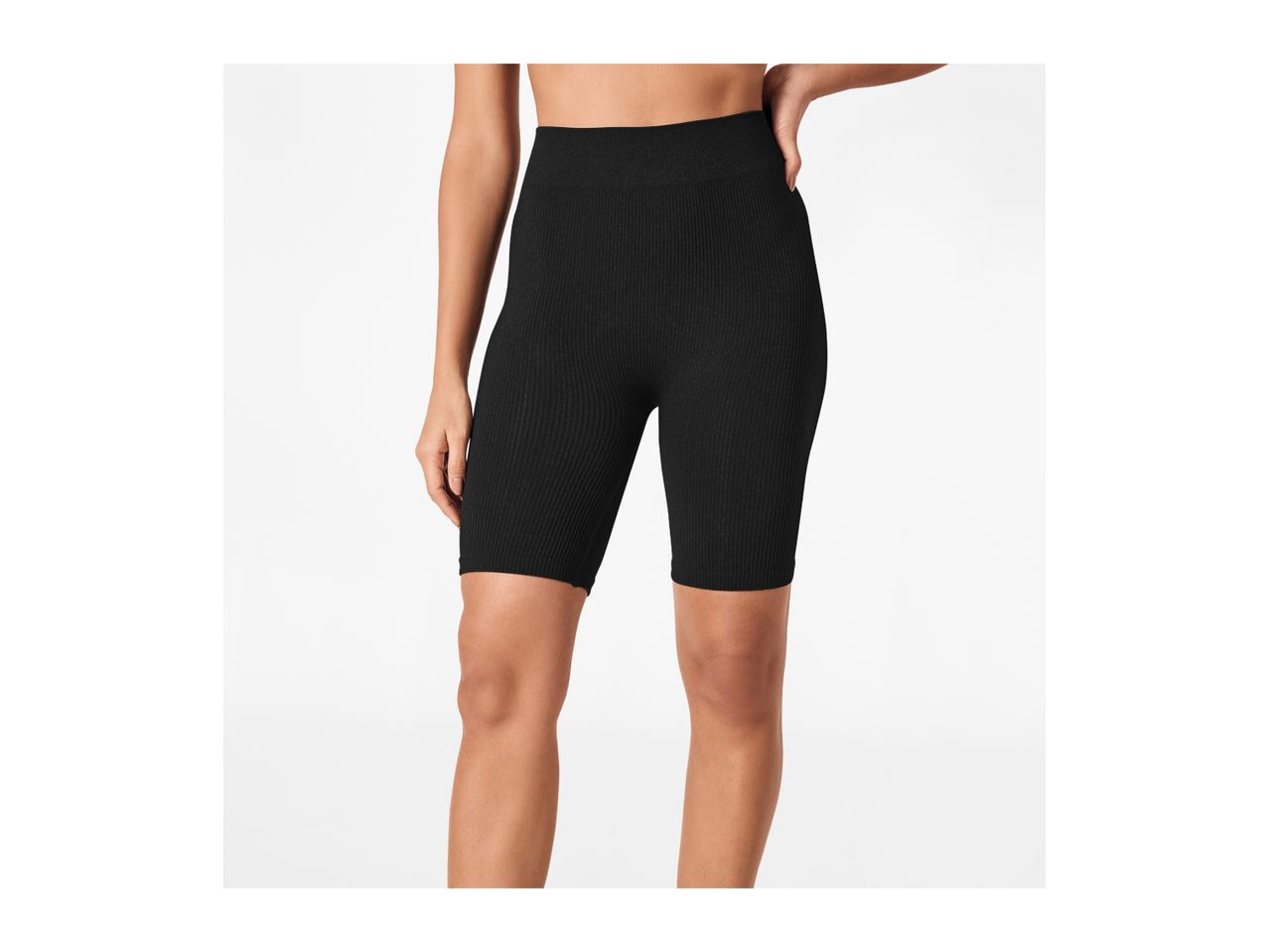 Woman wearing black ribbed cycling shorts.