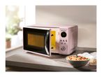 Pink SilverCrest microwave oven with an open door and a bowl of food on the counter.