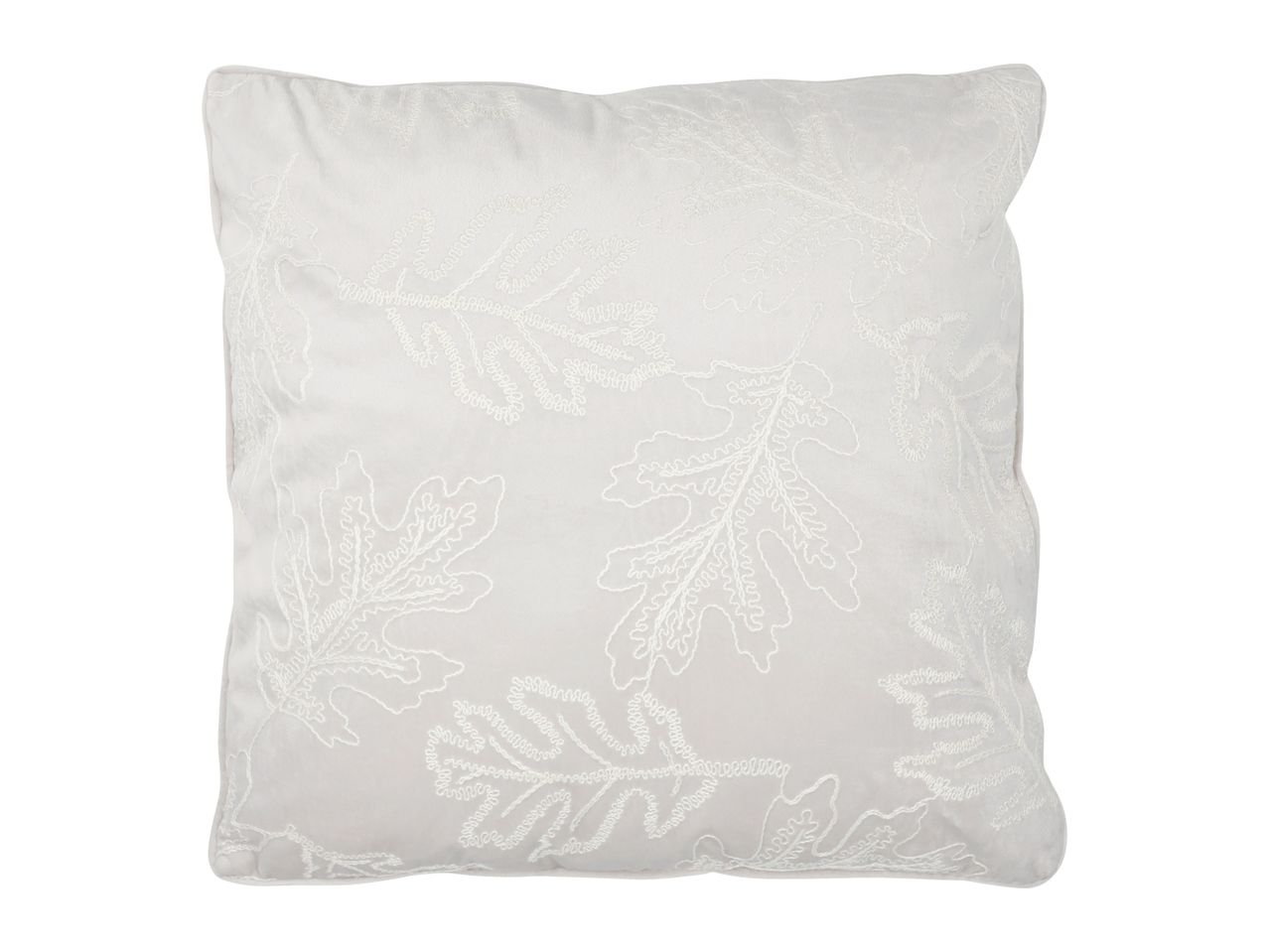 White cushion with embroidered leaf patterns