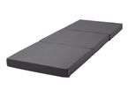 Dark grey foldable mattress, unfolded and lying flat