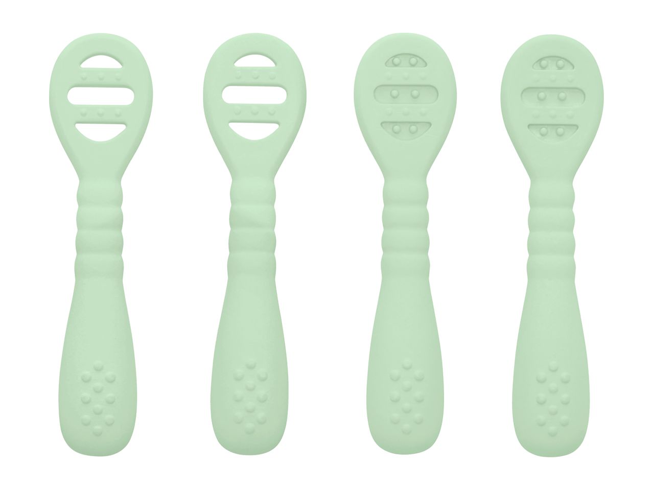 Four light green silicone baby spoons with textured handles and heads, two with slotted heads.