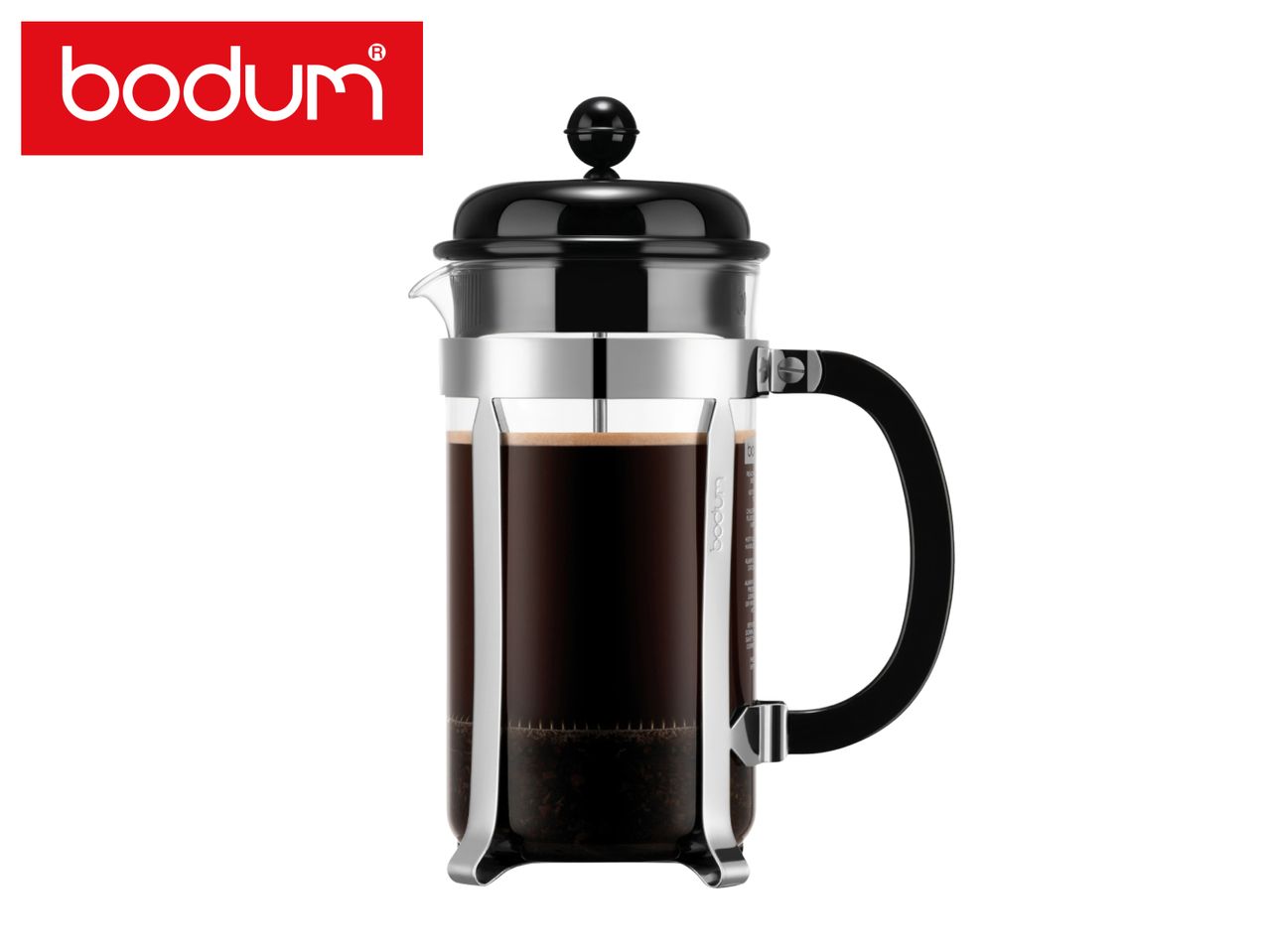 A classic glass French press coffee maker filled with freshly brewed coffee.