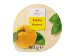 Japanese style yuzu dessert with a whole yuzu fruit and leaves on a bamboo mat, 150g.