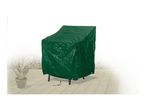 Green garden chair cover on a patio with a potted plant in the background.