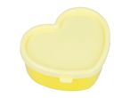 A pale yellow heart-shaped container.