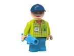 Toy figure of a man in a cap and plaid shirt holding a blue fish.
