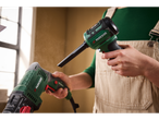 A person uses a Parkside® 12V Cordless Mini Blower and Duster to clean a power tool.