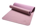 Pink yoga mat, partially rolled up, with textured surfaces.