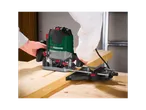 A person uses a Parkside hand router to work wood.