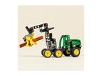 Toy tractor with a crane attachment holding a brown log, on a light background.