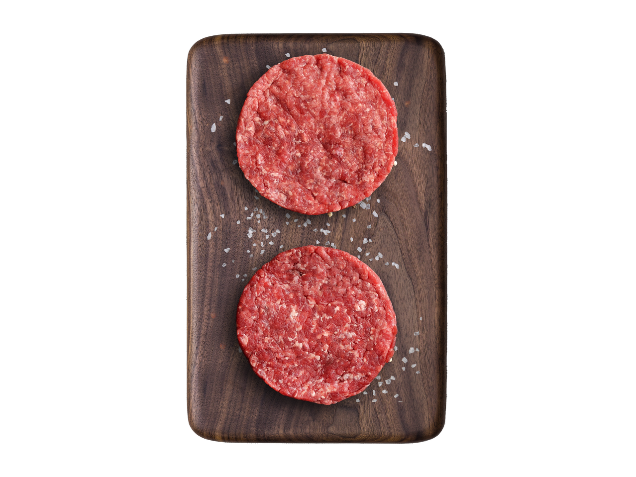 Du grilinės kotletai ant medinės lentos.