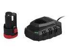 A black and red cordless tool battery next to a black battery charger with a green light.