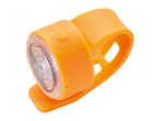 An orange silicone bike light with a power button.