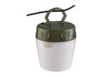 Portable camping lantern with a green top and white body, hanging from a dark branch.