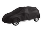 Black car cover fitted over a vehicle, showing the wheels and side sill