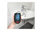 Hand holding a Parkside inspection camera with its probe in a bathroom sink drain.