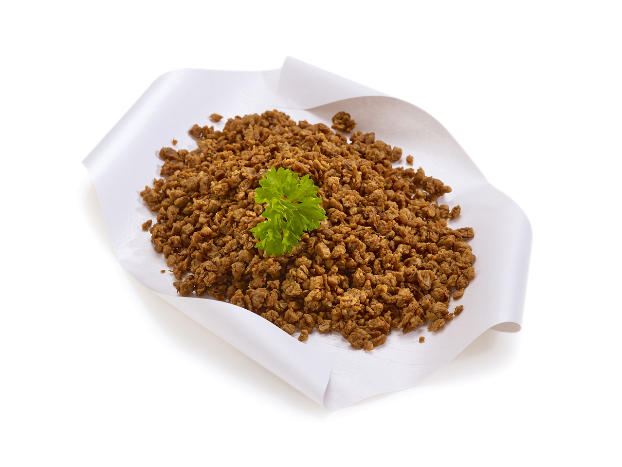 Hachis végétal Vemondo avec persil sur une feuille de papier blanc.