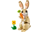 Toy rabbit with a carrot and a yellow flower