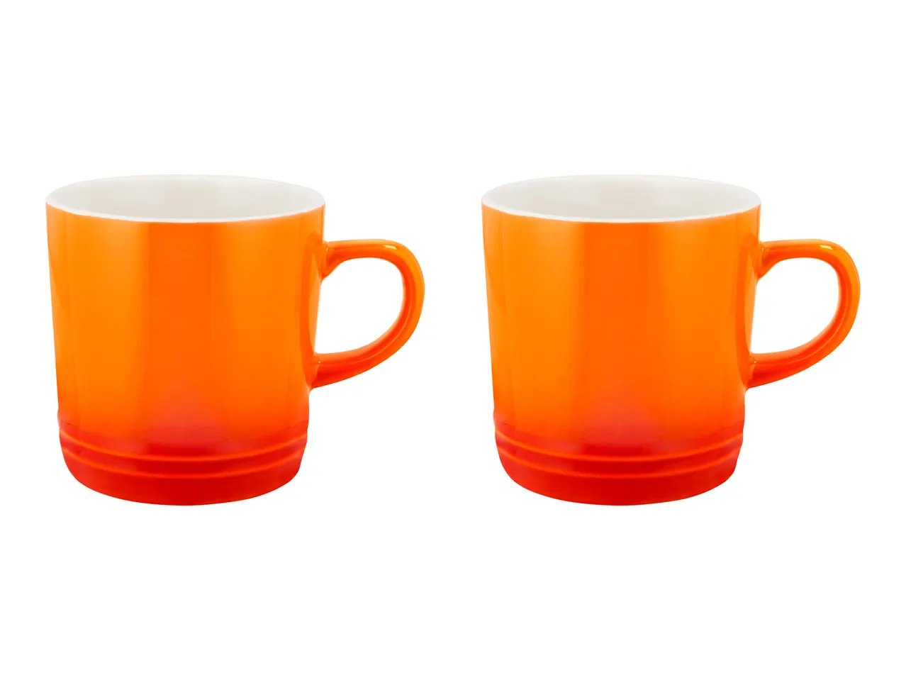 Two orange ceramic mugs with white interiors and handles.