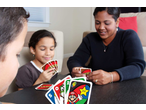 Family playing UNO Card Game with Mario-themed cards at a table.