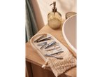 Manicure and pedicure tools on a marble tray.