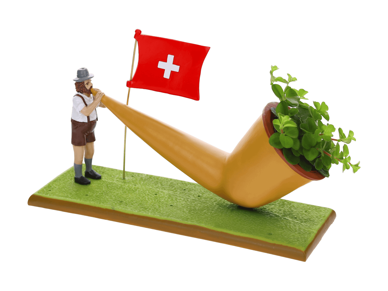 Figurine d'homme suisse jouant de l'alphorn avec un drapeau suisse et une plante.
