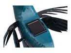 Close-up of a blue metal fish garden ornament with a solar panel on its back.